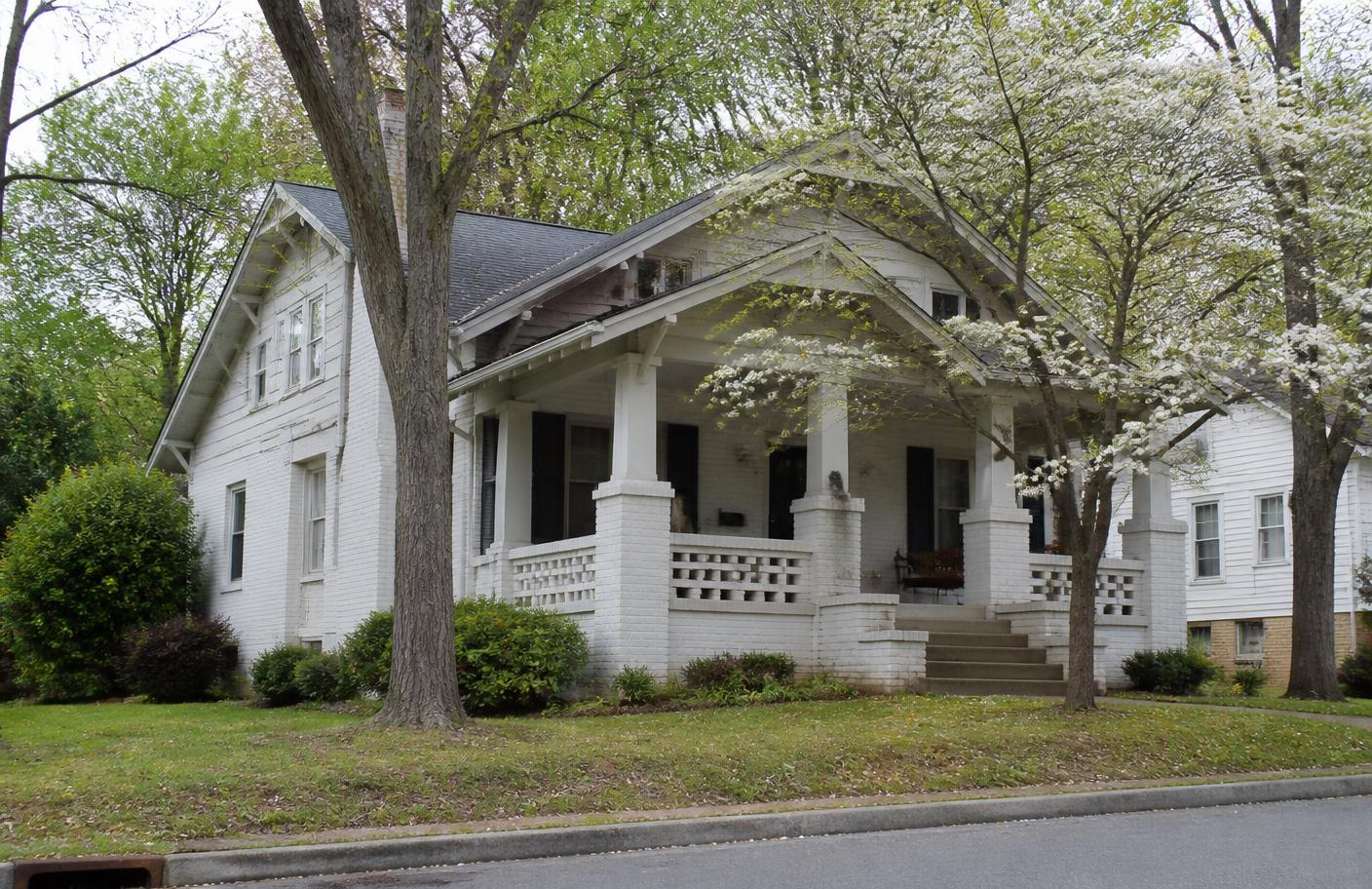 Older two-story Winston-Salem, North Carolina home with a stone and brick foundation
